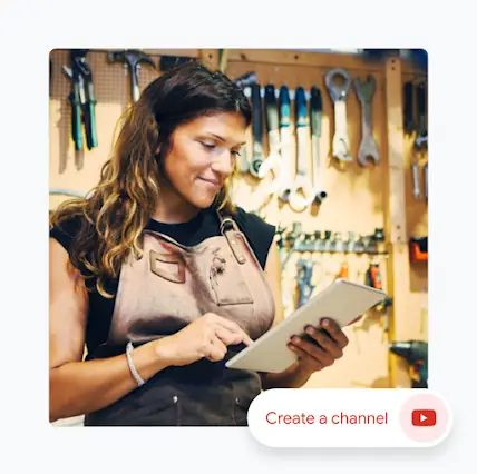 Woman in workshop looking at a tablet