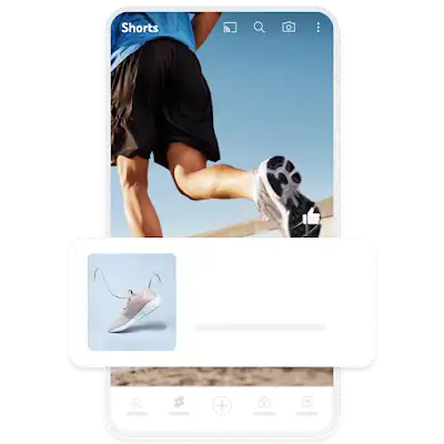 Példa egy mobilon megjelenő keresletgeneráló hirdetésre, amely egy YouTube Shorts-videóra helyezett fedvényen látható tornacipőt ábrázol.