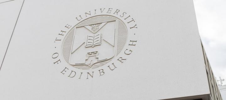 The university crest on the Informatics building