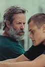 Guy Pearce and Vincent Miller in Inside (2024)