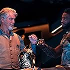 Pierce Brosnan and Aldis Hodge in Black Adam (2022)