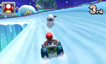 Mario and Toad driving to the finish with a Blooper. The Gateway Galaxy's starting planet can be seen.