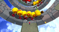 Mario in Supermassive Galaxy in Super Mario Galaxy 2. Big Wigglers are seen.