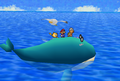 The whale transports Mario to the island.