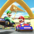 Luigi gliding in the Green Kiddie Kart with the Gold Glider on 3DS Toad Circuit