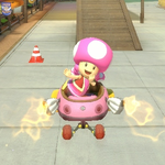 Toadette performing a trick. Mario Kart 8.