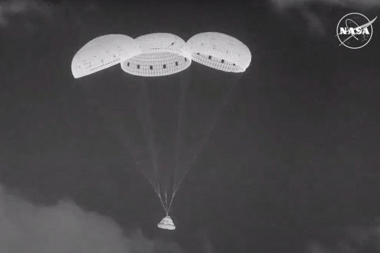 The Boeing Starliner capsule floats down to New Mexico.