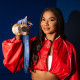 Jordan Chiles poses for a portrait holding her gold and bronze Olympic medals