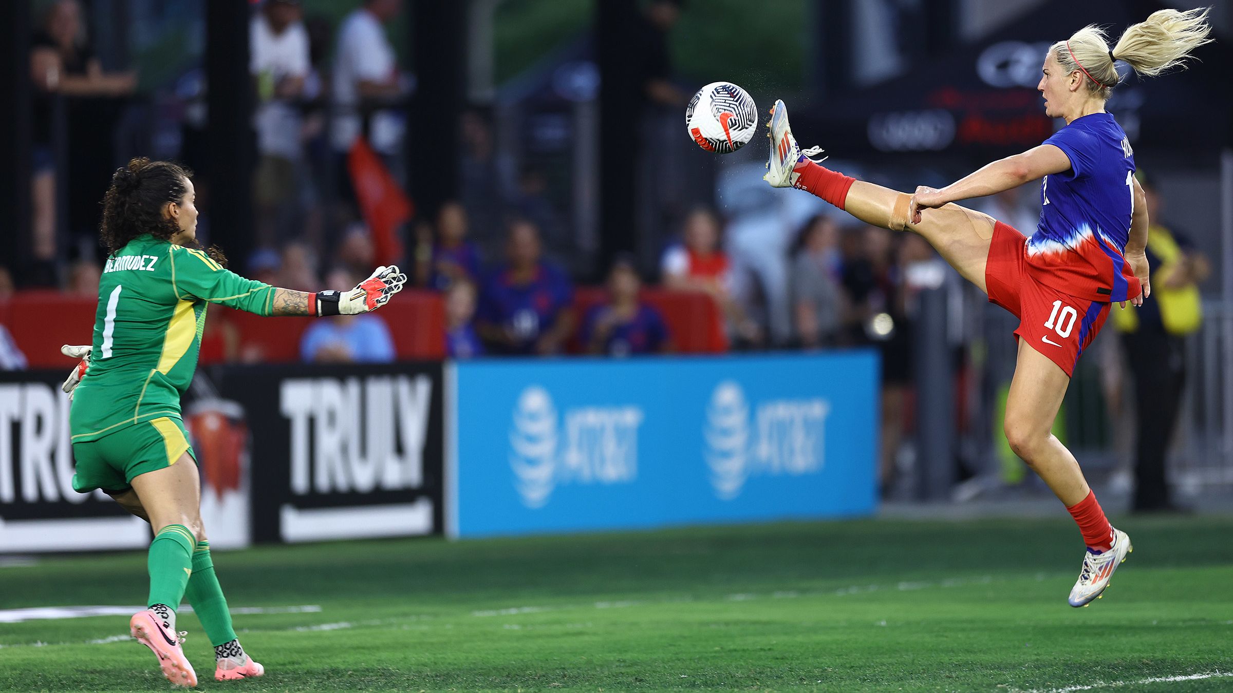 WASHINGTON, DC - JULY 16: Lindsey Horan #10 of the United States shoots as Noelia Bermúdez #1 of Costa Rica defends during the first half at Audi Field on July 16, 2024 in Washington, DC.