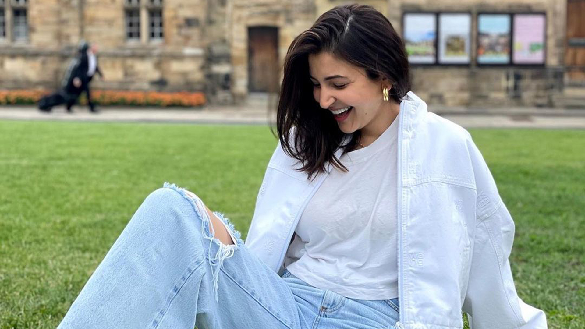 Anushka Sharma in a white jacket   ripped jeans