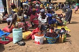 Women selling food products in an open street market