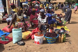 Women selling food products in an open street market