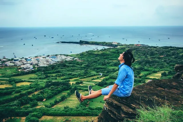 A lady on top of a mountain. This is what freedom must feel like.