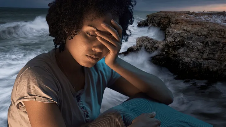 Close up of young black woman grimacing with insomnia, in front of a backdrop of stormy seas.