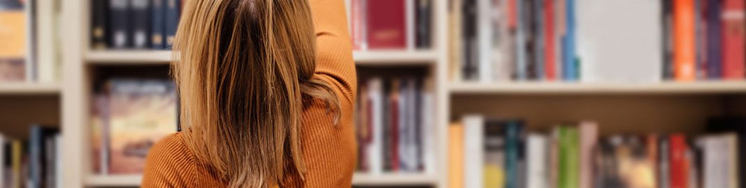 Woman browsing the bookstore shelves