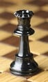 A real world black queen chess piece.