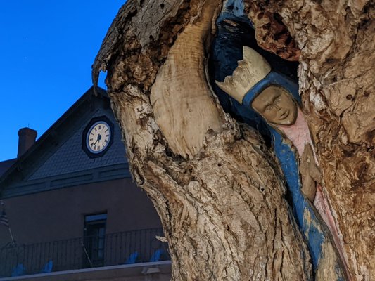 Photo of AbqTours - Albuquerque, NM, US. Virgin Mary tree carving outside of San Felipe de Neri Church, Old Town Albuquerque