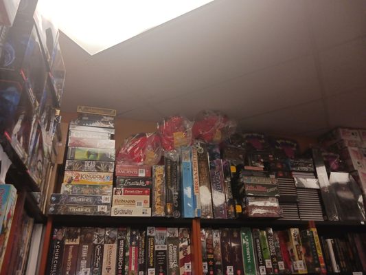 Photo of Around the Table Game Pub - Lynnwood, WA, US. a shelf full of dvds