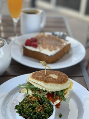 Photo of The Grove Cafe & Market - Albuquerque, NM, US. Fancy breakfast sandwich and brioche French toast