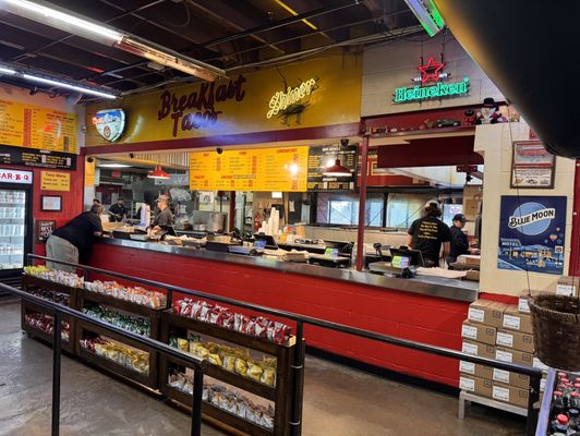 Photo of Rudy's "Country Store" and Bar-B-Q - Albuquerque, NM, US. shows customers at the counter