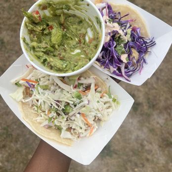 Shrimp and chicken tacos on corn tortillas. Side of guacamole