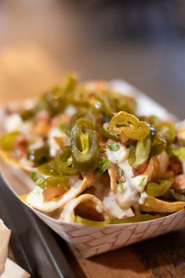 Photo of Taco Jed - Rochester, MN, US. a plate of nachos on a table