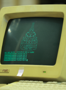 Image depicts an older computer with a digital birthday cake.