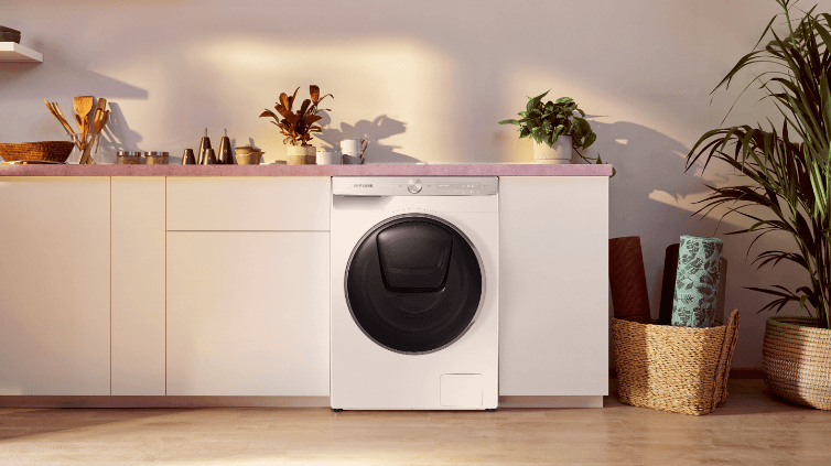 Stylish washing machine in white laundry.