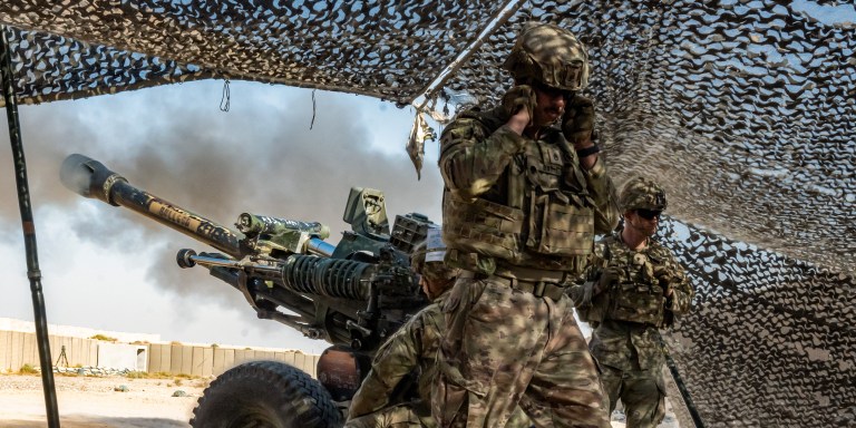 U.S. Army Soldiers assigned with 2nd Battalion, 15th Field Artillery Regiment, 2nd Brigade Combat Team, 10th Mountain Division, also known as “Task Force Redleg” fires the M119A3 Howitzer during a joint artillery training exercise at Al Asad Air Base, Iraq, on Oct. 26, 2023. The exercise was conducted to offer training to partner forces in support of the Combined Joint Task Force - Operation Inherent Resolve's mission in the enduring defeat of Daesh. (U.S. Army photo by 2nd Lt. Daphney Black)