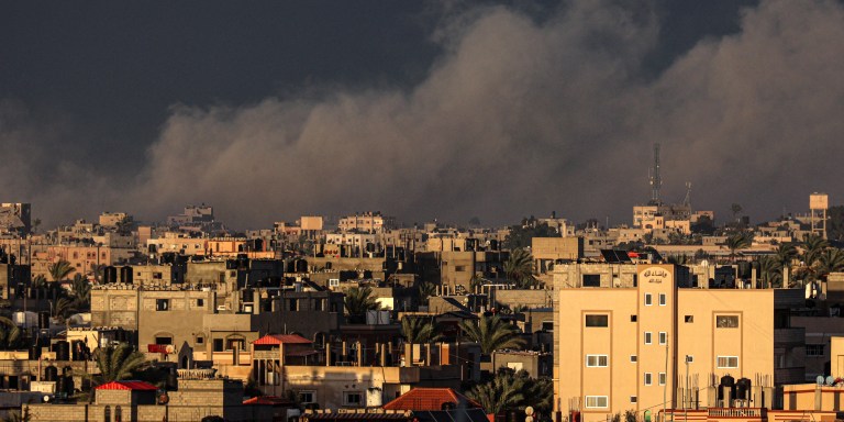 A picture taken from Rafah shows smoke billowing over Khan Yunis in the southern Gaza Strip during Israeli bombardment on January 11, 2024, amid ongoing battles between Israel and Palestinian Hamas militants in the Gaza Strip. (Photo by AFP) (Photo by -/AFP via Getty Images)