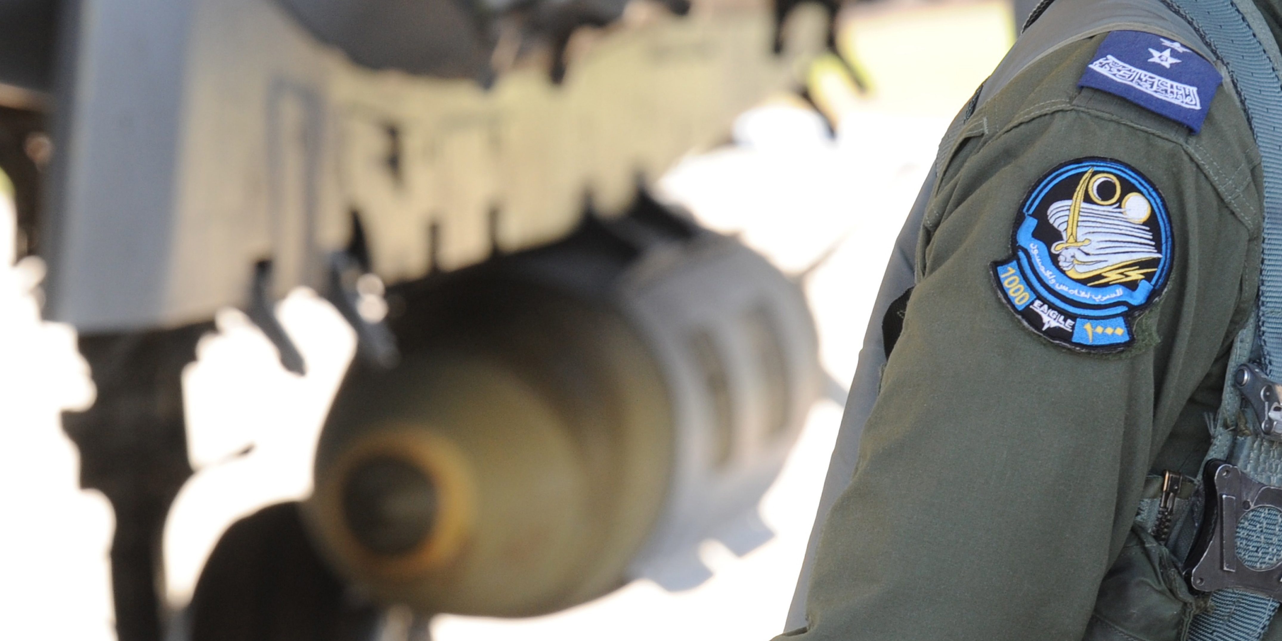 A Saudi pilot walks past a F-15 fighter jet at the Khamis Mushayt military airbase as the Saudi army conducts operations over Yemen on November 16, 2015.