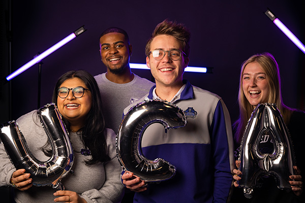 Students holding balloons