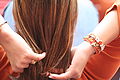 Woman in orange with orange jewellery