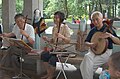 Two erhu players and a yueqin player at 72 Martyrs Parks, Guangzhou, China