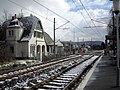 Stop Küdinghoven of the tram line 62 with the former station building in Bonn