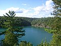 * Nomination Pink Lake in Gatineau Park, Canada.--Jamez42 17:51, 25 July 2014 (UTC) * Decline Big blurry areas in the foreground. Background lacking fine details in the trees. Lake is noisy. Magenta CA available. Too much issues, sorry. --Cccefalon 18:33, 25 July 2014 (UTC)