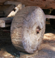 An early wheel made of a solid piece of wood]]