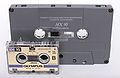 A microcassette and compact audio cassette.