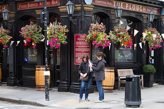 Couple of tourists searching for directions on map.