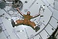 Astronaut Gerald Carr floats in forward dome