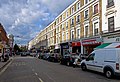 View north up Queensway, London from in front of the entrance to Bayswater tube station