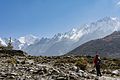 * Nomination: A traveler taking a short break during her trek to Kyanjin Gompa in the Langtang National Park to admire the Langtang Mountain range. By User:Shresthasunny --Bijay chaurasia 09:02, 24 May 2017 (UTC) * * Review needed