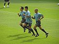 Referee warming up with two assistant referees.