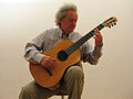 Carlo Domeniconi playing a guitar by Luigi Mozzani