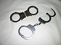 Handcuffs with hinged and chained connection