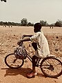 File:A boy riding bicycle from school.jpg