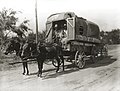 A migrant farmer's wagon with mules harnessed to its tongue.