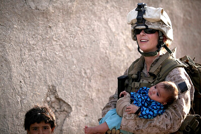 File:100803-M-0301S-162 HM2 Claire E. Ballante, assigned to the Female Engagement Team (FET), holds a child during a patrol with 1st Battalion 2d Marines.jpg