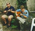 Musicians playing mandolin (left) and guitar