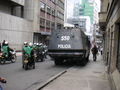 Policemen watching a demonstration, Bogotá, Colombia